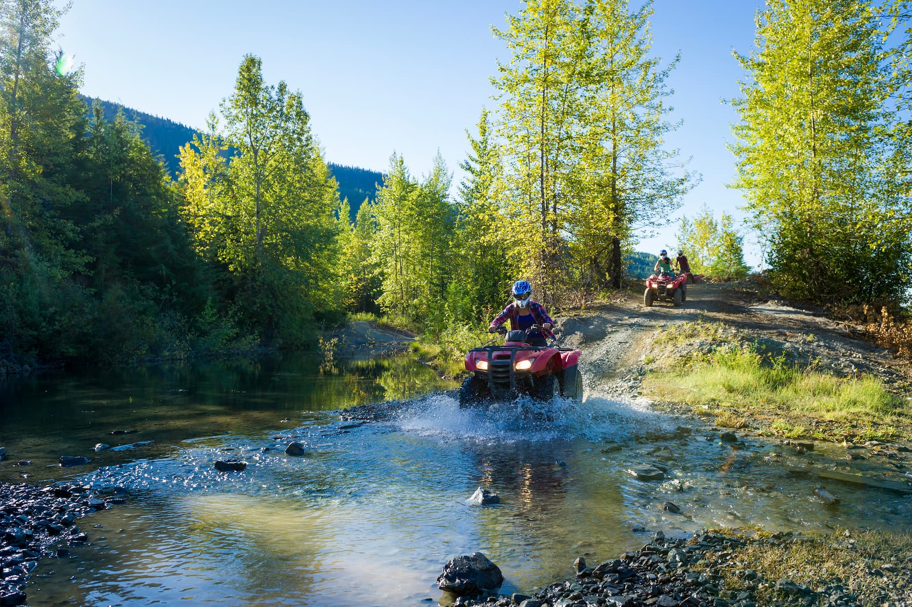 Adventure enthusiast with RV in mountain setting